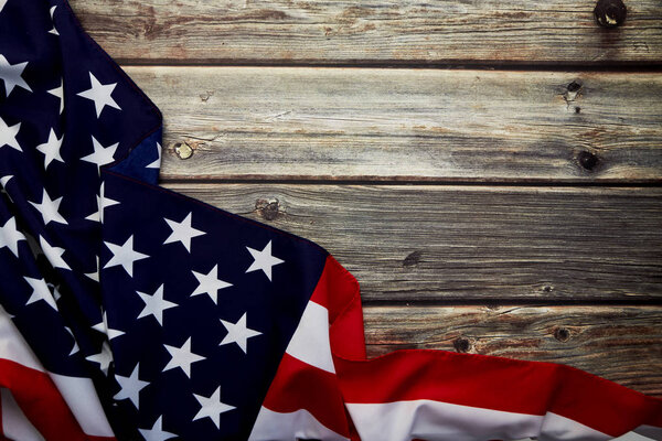 American flag on old rustic wooden board