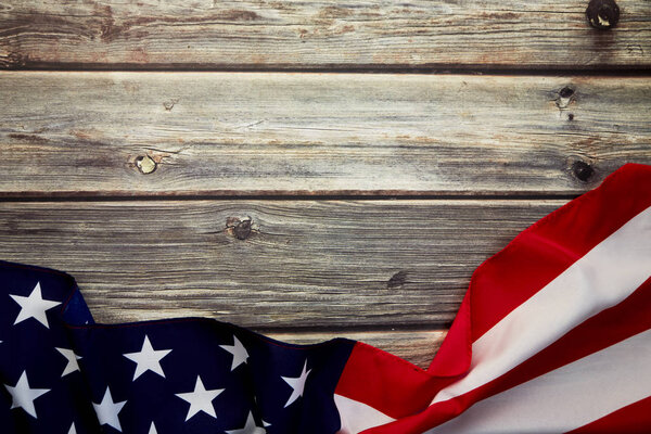 American flag on old rustic wooden board