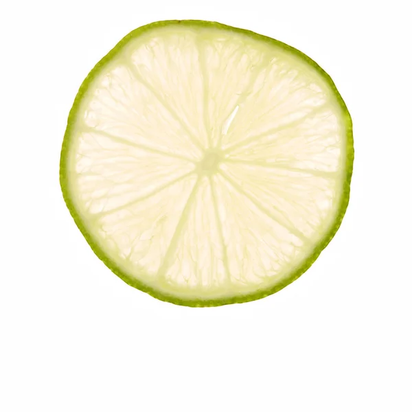 Slice fresh lime on white — Stock Photo, Image