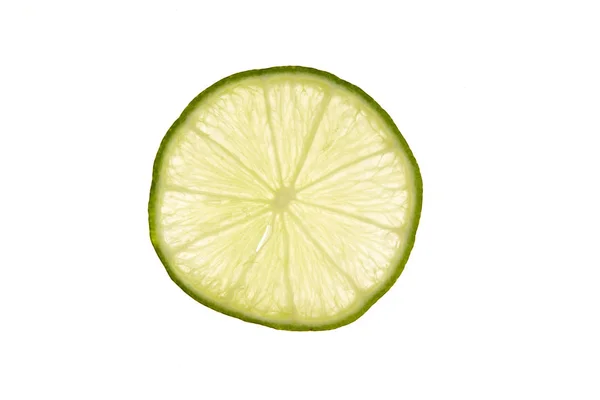 Tranche de citron vert frais sur blanc — Photo