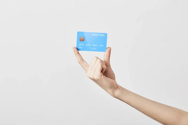 Karta kredytowa w ręku na białym — Zdjęcie stockowe