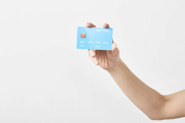 Kreditní karta v ruce na bílém — Stock fotografie