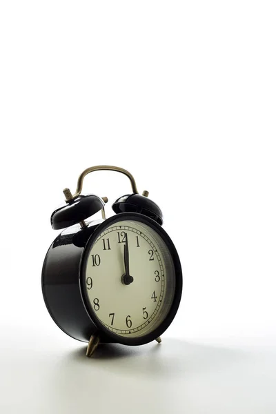 Black alarm clock retro style on white background — Stock Photo, Image