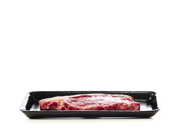 Raw beef steak in  package on white — Stock Photo, Image