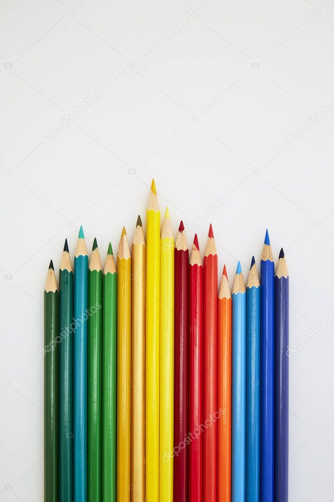 Colorful wooden pencils for drawing on white