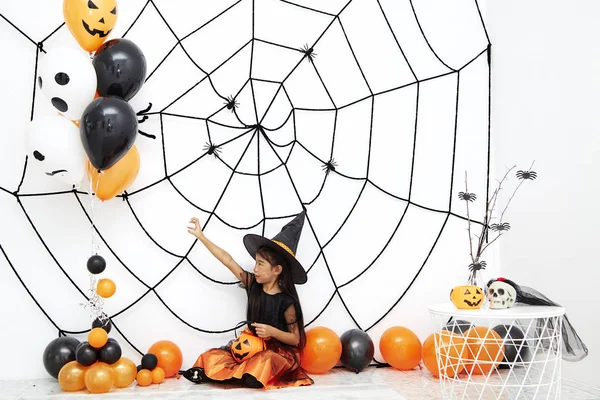 Happy Halloween little witch with a pumpkin — Stock Photo, Image