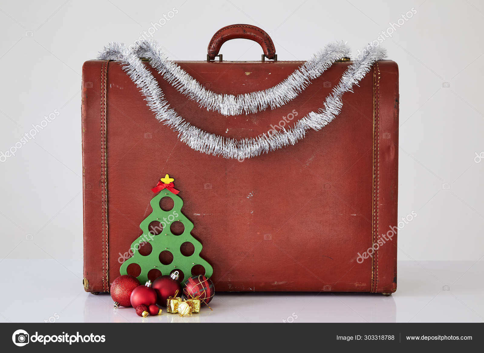 Vintage Suitcase With Christmas Decorations On White Stock Photo