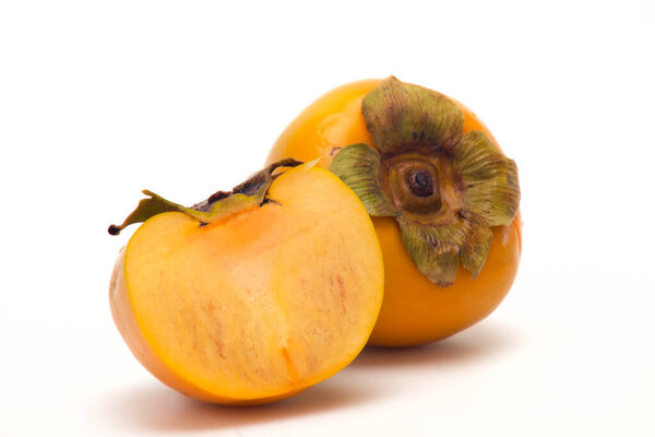 Fresh Ripe persimmon and Slice persimmon on white isolated background.