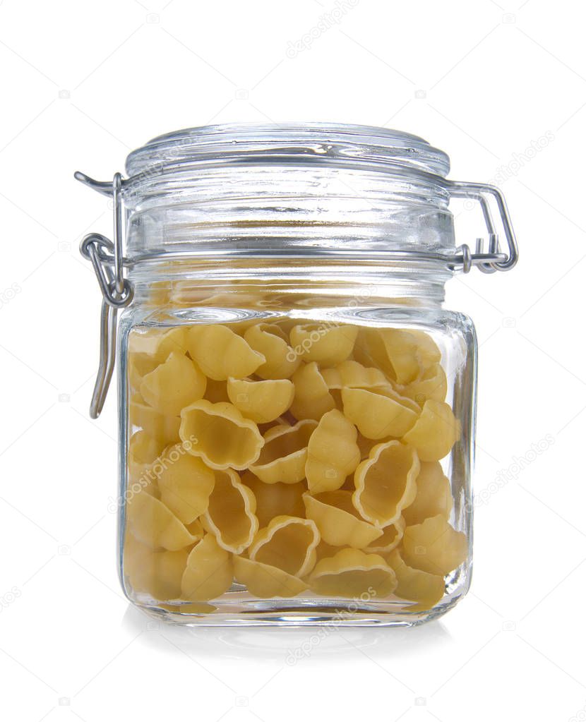 Pasta in glass jar on a white background 
