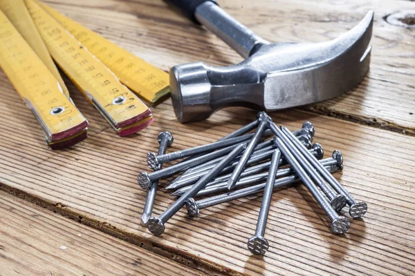 Nails Hammer Folding Ruler Wooden Background — Stock Photo, Image