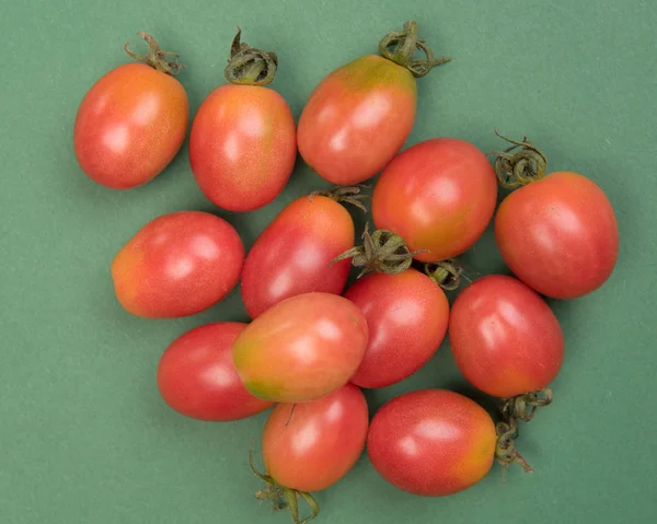 Cherry tomatoes on a colored background