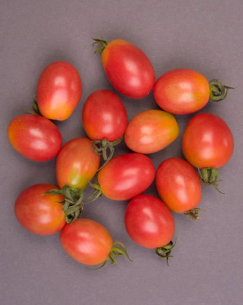 Cherry tomatoes on a colored background