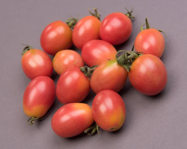 Cherry tomatoes on a colored background