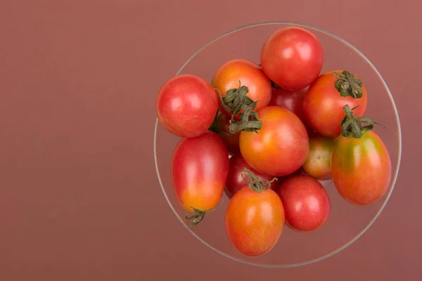 Cherry tomatoes on a colored background