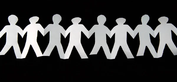 White Paper Cut People Hold Hands Connected Black Background — Stock Photo, Image