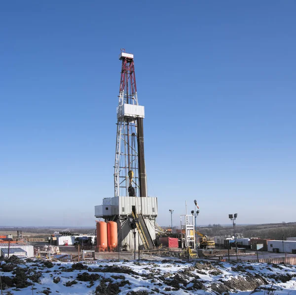 Drilling a deep well with a drilling rig at an oil and gas field