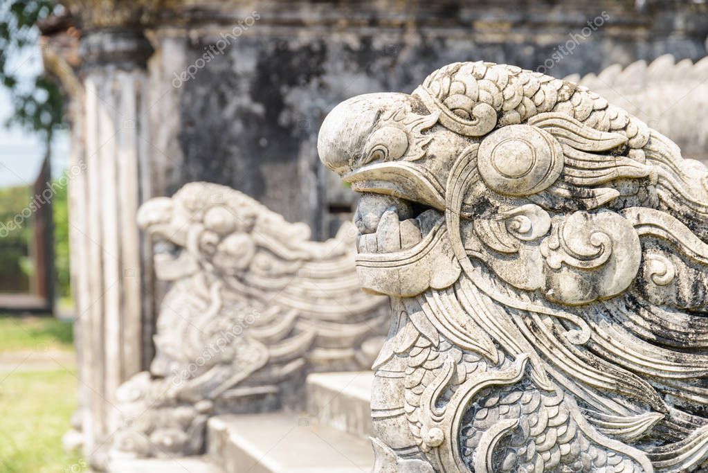 Amazing stone sculptures of dragons at the Imperial City in Hue, Vietnam. Hue is a popular tourist destination of Asia.