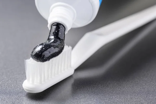 Close View Black Charcoal Toothpaste Being Squeezed White Toothbrush Whitening — Stock Photo, Image