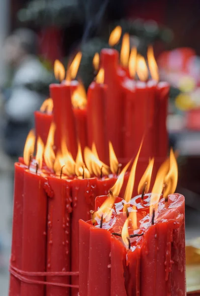 Awesome closeup view of burning red ritual candles — Stock Photo, Image