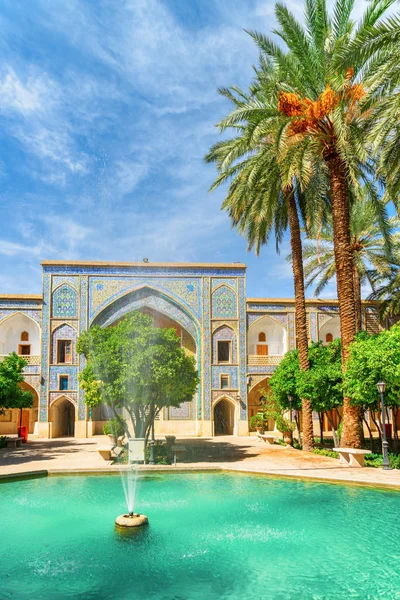 View of fountain in the middle of traditional Persian courtyard