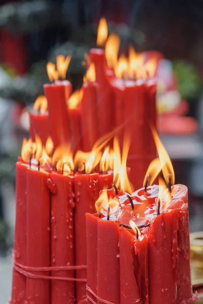 Amazing closeup view of burning red ritual candles — Stock Photo, Image