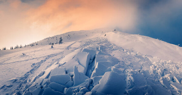 Snow avalanche in winter mountains