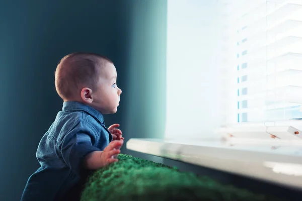 Newborn baby boy on green carpet closeup — Stock Photo, Image