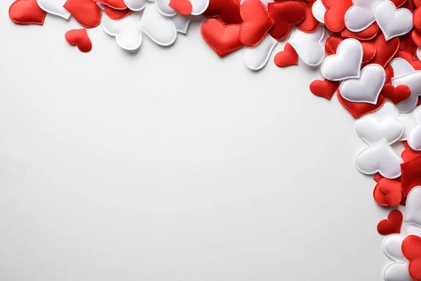 Red and white textile hearts on white background — Stock Photo, Image