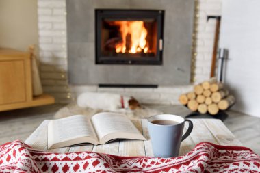 Hygge concept with open book clipart