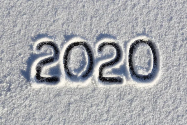 2020. Writings on the snow. Happy new year. Beautiful cold sunny winter day.