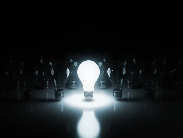 Light Bulbs Stand Row One Glows Dark Background — Stock Photo, Image
