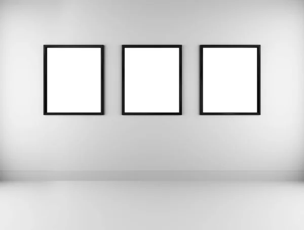 Three blank picture frames on wall