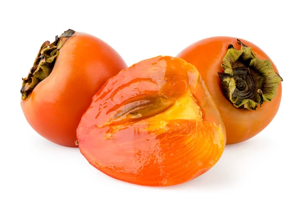 Ripe persimmon and half close-up on a white. Isolated. — Stock Photo, Image