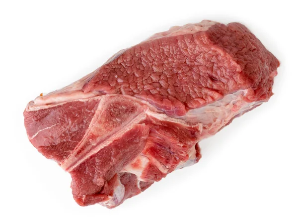 Stück rohes Fleisch auf einem weißen. der Blick von oben. — Stockfoto