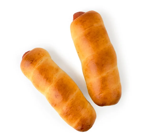 Two sausages in the dough top view. Isolated. — Stock Photo, Image