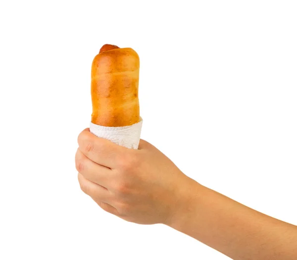 Sausage roll in hand. Isolated. — Stock Photo, Image