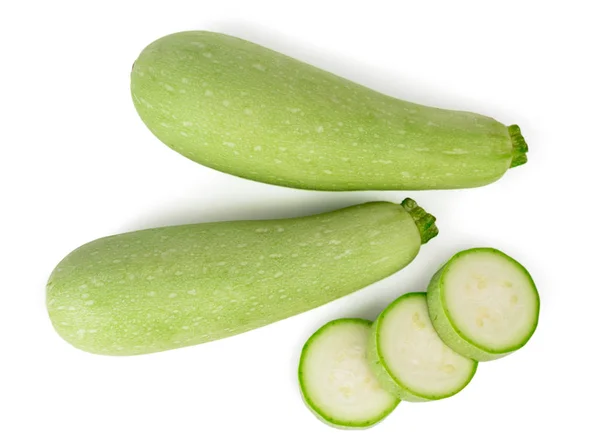 Två zucchini och zucchini ringar ovanifrån på vit bakgrund. — Stockfoto