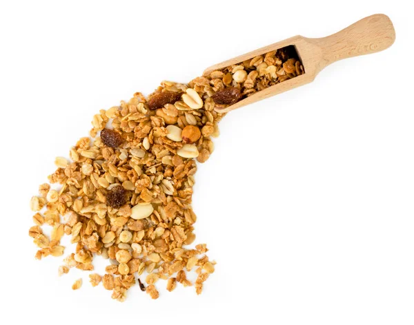 Muesli fell out with a wooden spoon on a white background. — Stock Photo, Image