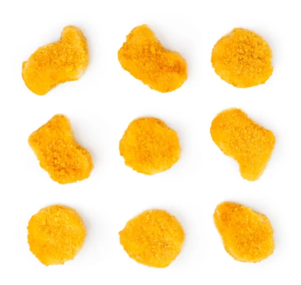 Nuggets de pollo colocados sobre un blanco. La vista desde arriba . — Foto de Stock