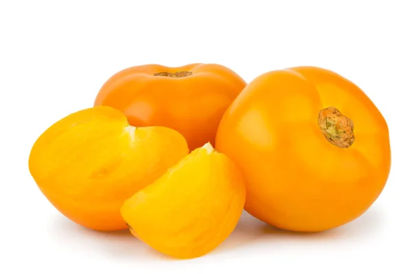 Yellow tomatoes half and slice on a white, isolated. — Stock Photo, Image