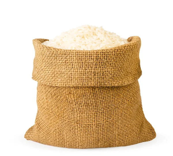Bolso lleno de arroz de cerca sobre un blanco. Aislado . — Foto de Stock