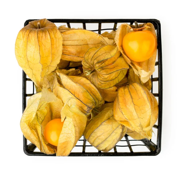 Physalis in a basket on a white. The form of the top. — Stock Photo, Image
