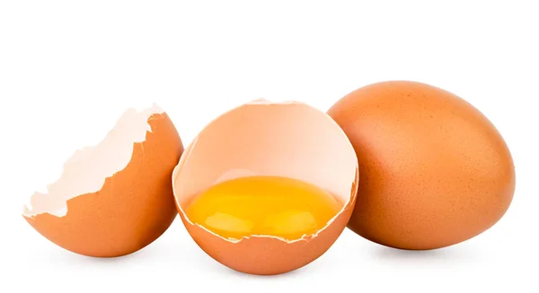 Slepičí vejce a dvě půlky na bílé, izolované. — Stock fotografie