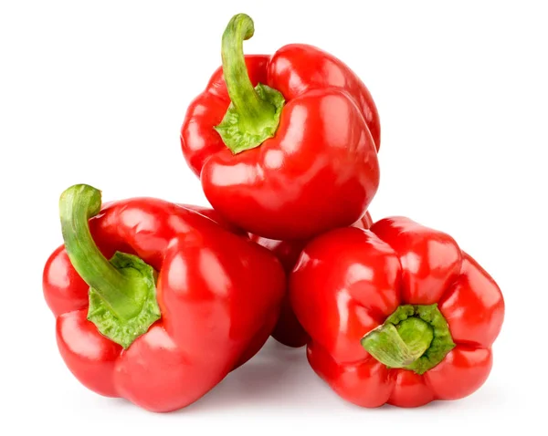 Stapel van rode paprika op een wit, geïsoleerd. — Stockfoto