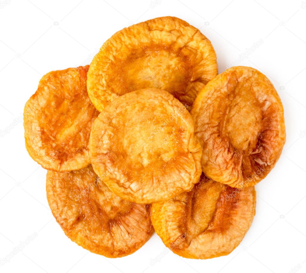 Heap of dried peaches on a white. The form of the top.