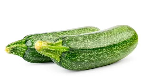 Due zucchine mature primo piano su fondo bianco . — Foto Stock
