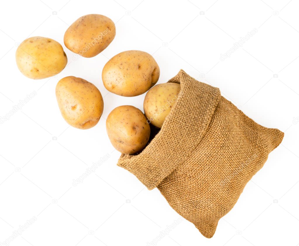 Potatoes scattered from a bag on a white. The form of the top.
