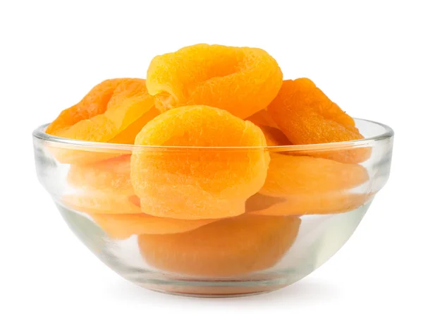 Dried apricots in a glass plate close-up on a white. Isolated. — Stock Photo, Image