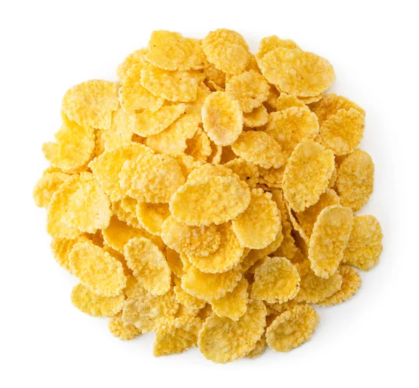 Haufen Cornflakes auf einem weißen. die Form des Kreisels. — Stockfoto