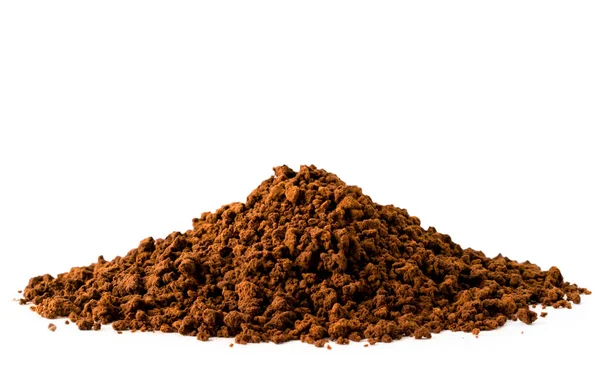 Heap of ground coffee close up on a white. Isolated. — Stock Photo, Image